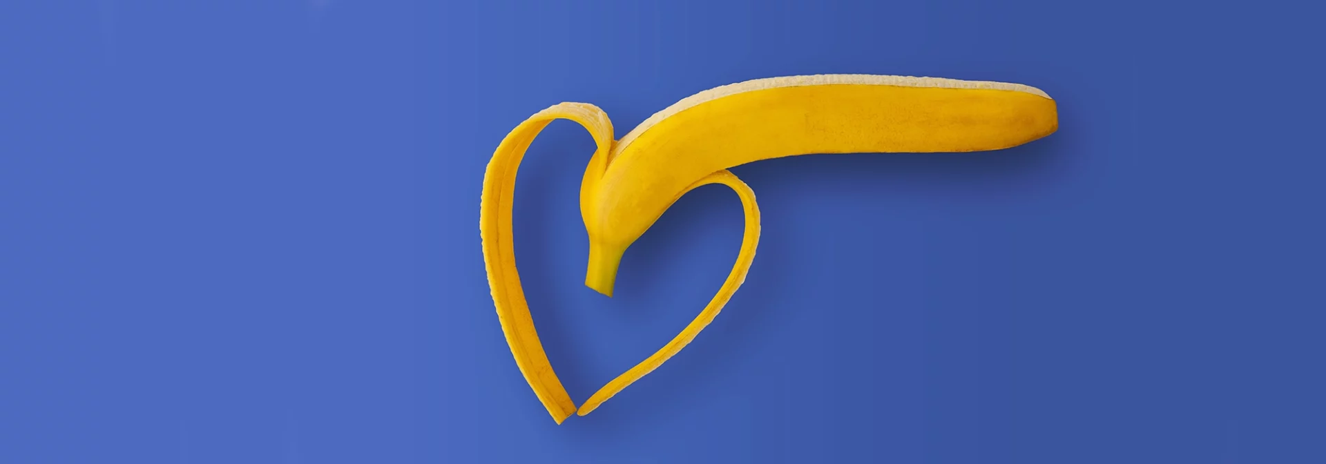 half peeled banana in shape of heart