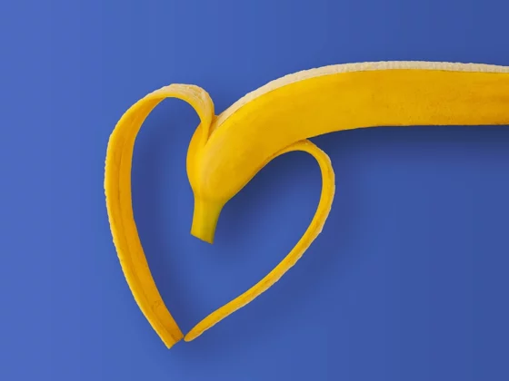 half peeled banana in shape of heart