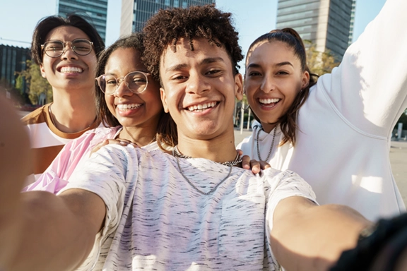 diverse teens in a group, selfie of smiling diverse teens