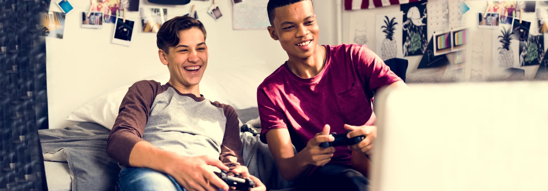 teen boys gaming together in room