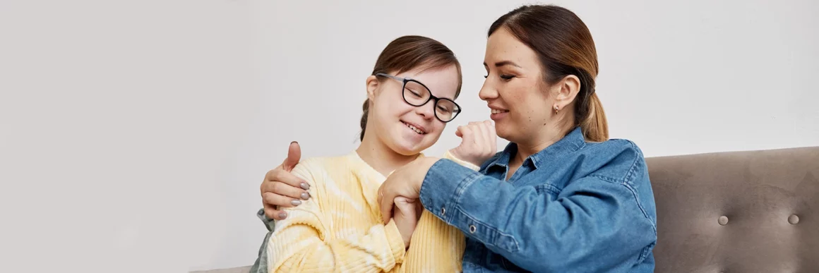 Mother with daughter hugging. 