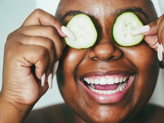 diverse teen with cucumbers on eyes, skin care routine