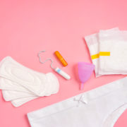 White,Pants,With,Sanitary,Napkins,,Tampons,,Menstrual,Cup,On,Pink