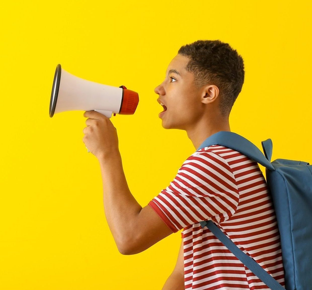 Portrait,Of,African-american,Teenage,Boy,With,Megaphone,On,Color,Background